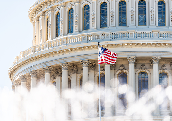 rotunda of the capitol building with American flag 